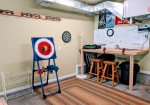 Garage games include Axe throwing safety axes, magnetic darts, and putt-putt golf.
